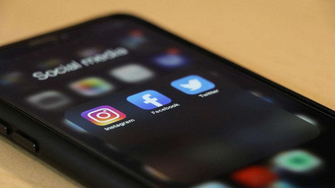 Social media terms - Black iphone 4 on brown wooden table