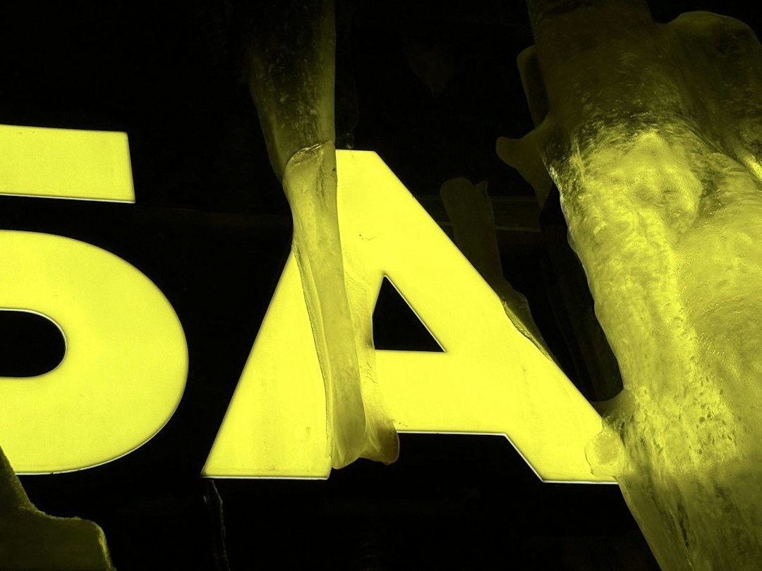 Symbols and numbers - Yellow text on black background with abstract shapes